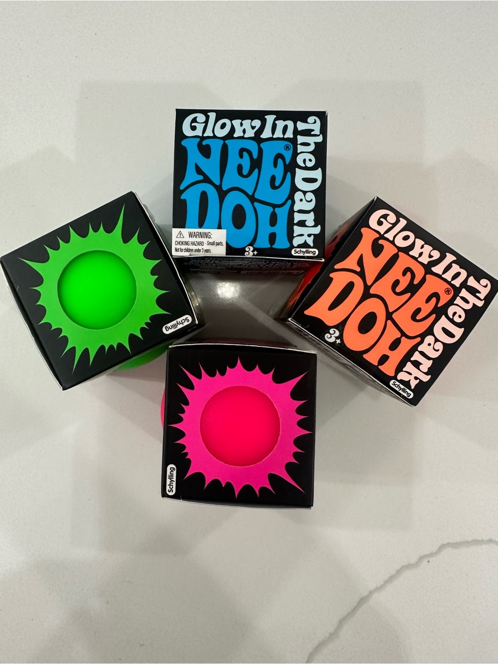 NeeDoh Set of 4 Glow in the Dark Squishy Ball - Pink, Green, blue & orange